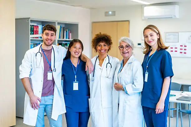 Group of medical staff standing together in a clinical setting